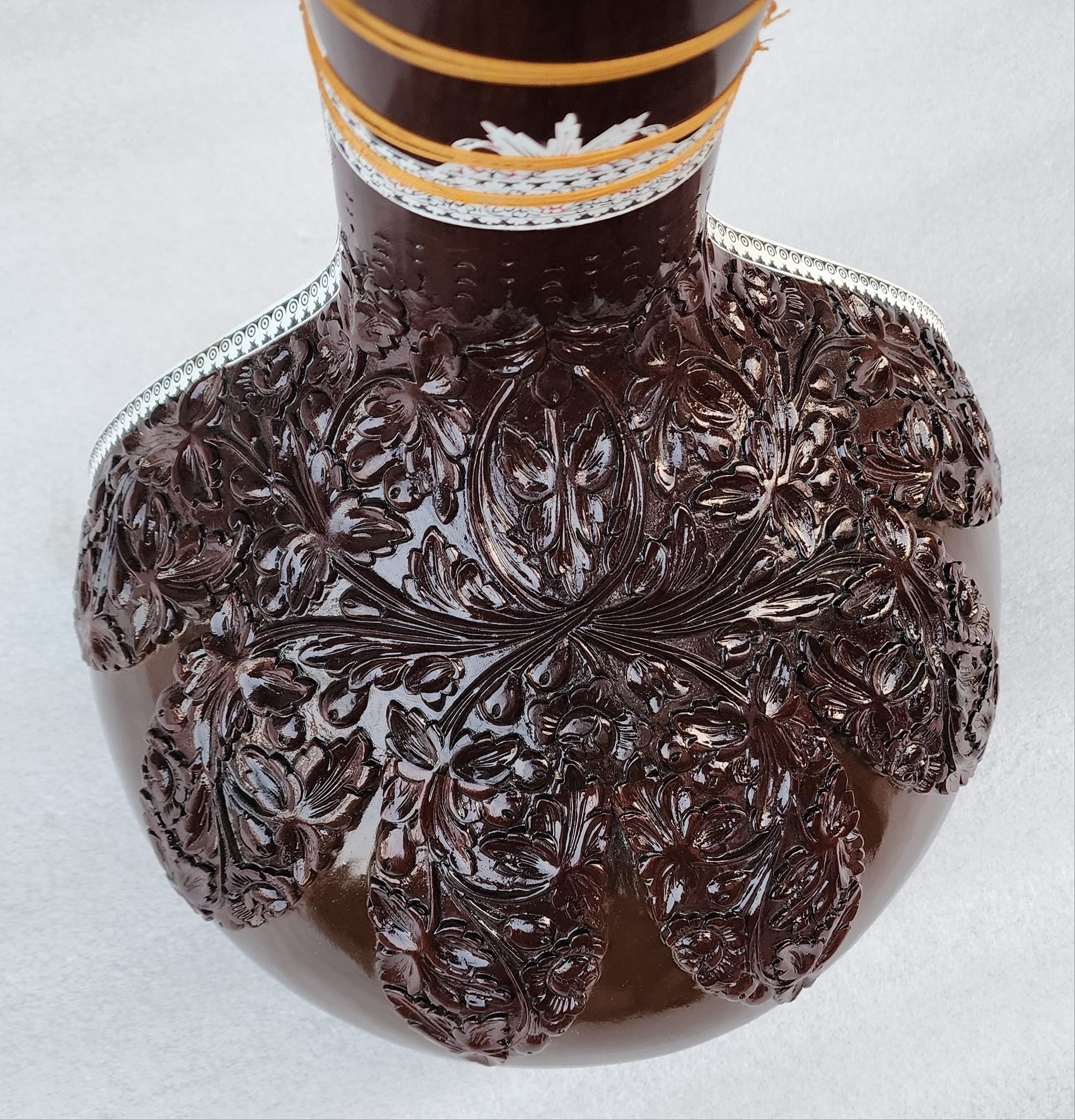 Hand-carved instrument ornamentation